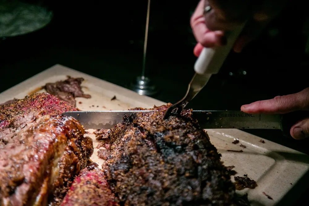 A chef carving a roast