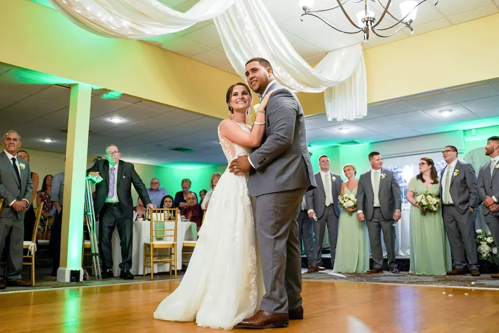 A first dance surrounded by the wedding party